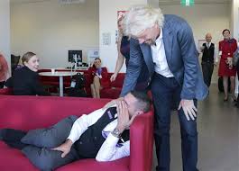 Richard Branson photobombs his employee